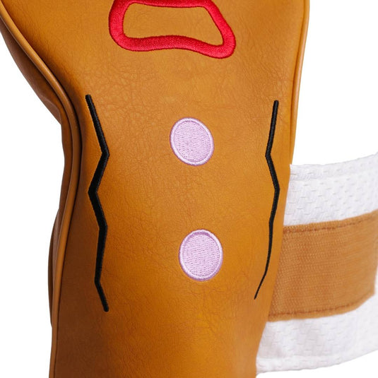 Close-up of frosting gumdrop buttons on Gingerbread Man Head Cover with the strap opened.