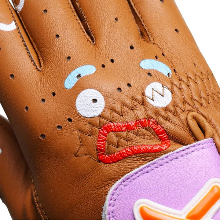 Translation missing: en.Closeup of the Gingerbread Man Golf Glove Gingy face across the knuckles with blue frosting eyebrows, white frosting eyes, and red frosting mouth in a worried facial expression