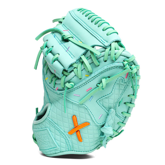 Side view of the all mint youth catcher's mitt with stitched pink, yellow, purple, and blue sprinkles across the the drip pattern of the glove