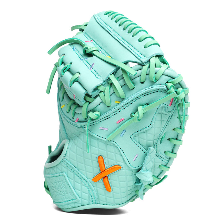 Translation missing: en.Side view of the all mint youth catcher's mitt with stitched pink, yellow, purple, and blue sprinkles across the the drip pattern of the glove