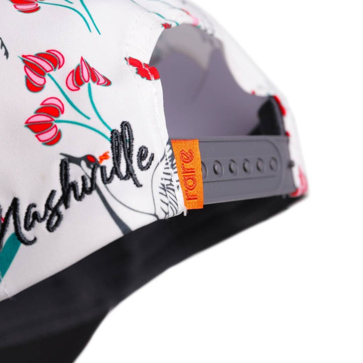 Translation missing: ja.“Back view of the floral baseball cap showing adjustable snapback strap and printed design, with orange rare tab.”