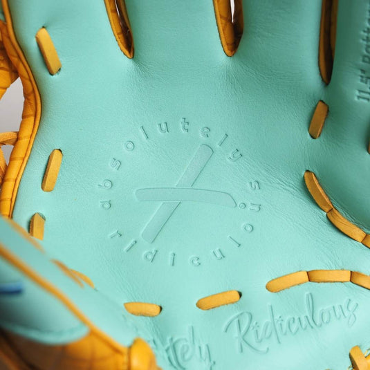 Close-up of a mint colored design and and yellow lacing with branding text.