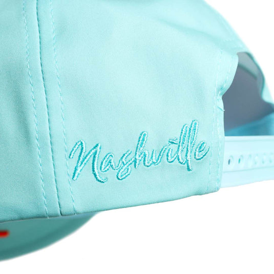 Close up shot of the back of the mint hat with 'Nashville' text embroidered near the snapback
