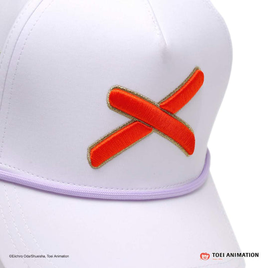 close up shot of the hat with the orange 'X' logo bordered in a gold outline