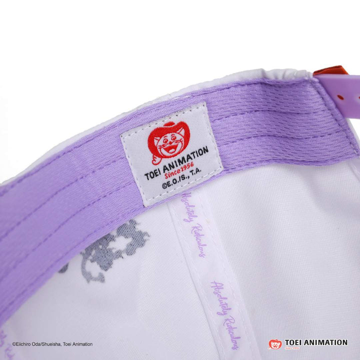 Translation missing: es.Close-up of a purple and white cap with Toei Animation logo and text
