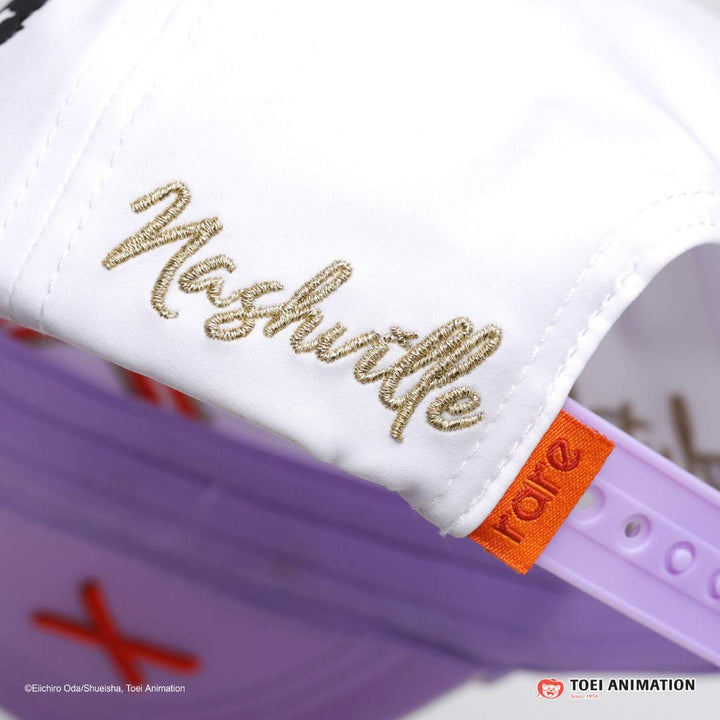 Translation missing: es.Light gold 'Nashville' embroidery and orange 'Rare' brand tag attached to the purple snapback logo