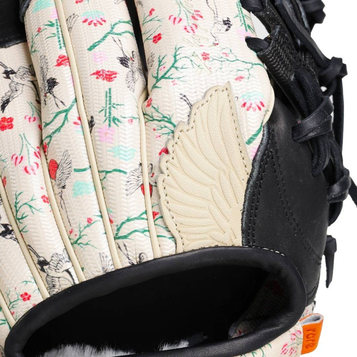 Translation missing: en.front view close up focusing on the glove’s pink and green floral pattern and cream and wing finger pad surface