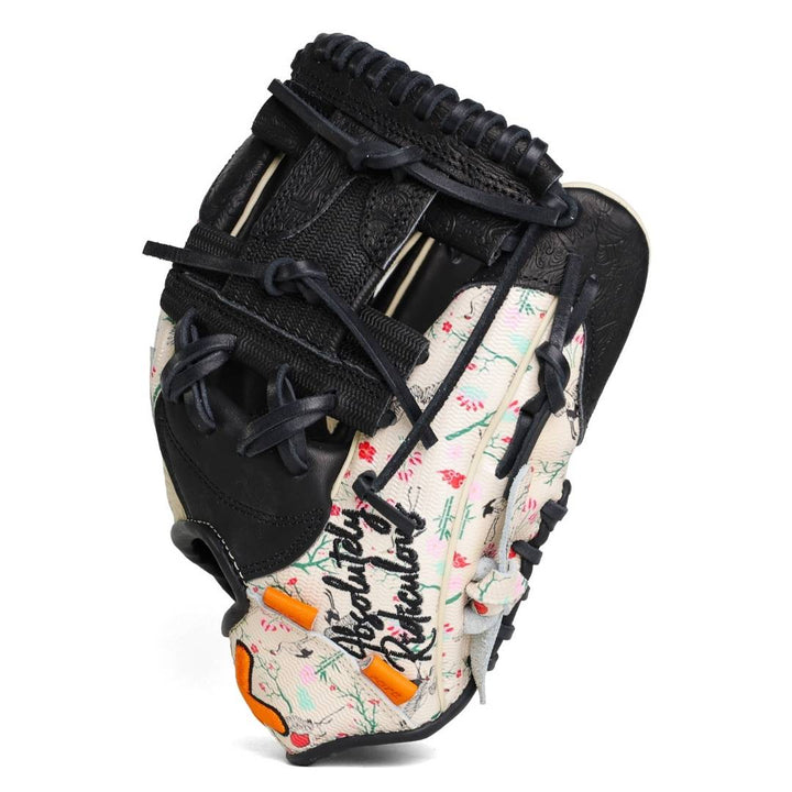 Translation missing: en.Angled side view of the floral baseball glove showing both and thumb areas and web
