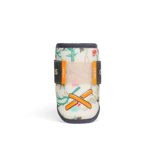 “Front view of a floral patterned elbow guard with orange X stitching and adjustable straps.”