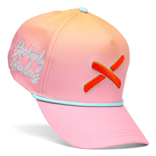Angled view of a peach-pink gradient baseball cap featuring teal trim, embroidered script on the front left panel, and a bold orange X logo on the side.