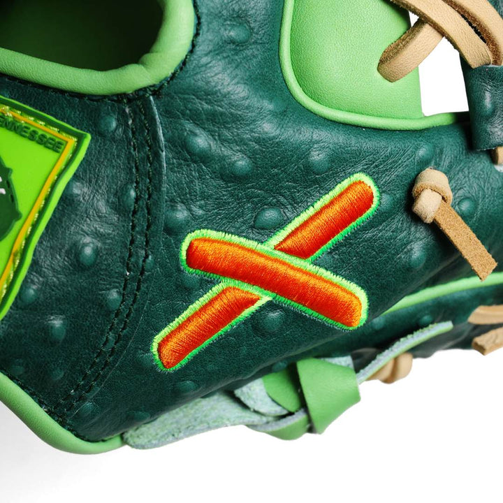 Translation missing: ja.Side view of the glove displaying tan laces and an embroidered orange and orange “X” logo with light green outline