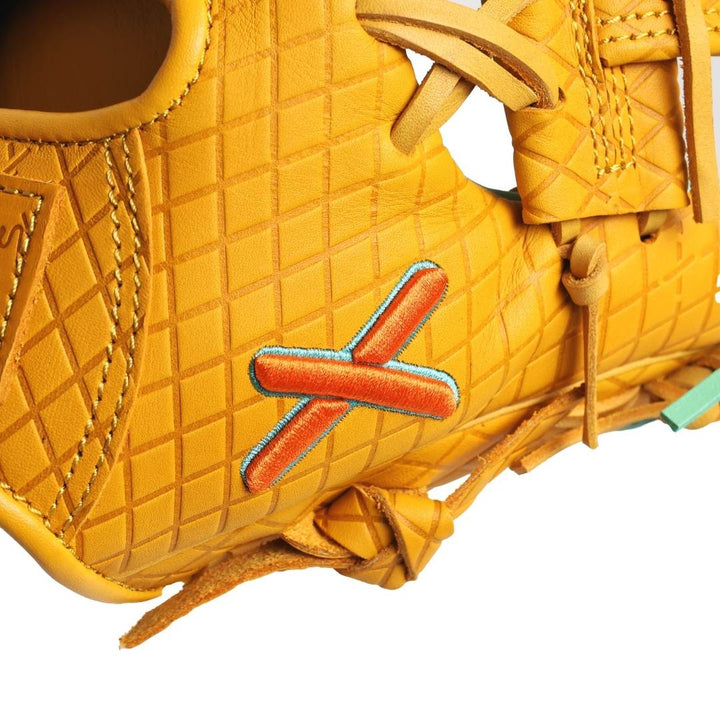 Translation missing: en.Close-up of a yellow leather glove with a orange 'X' logo on a white background